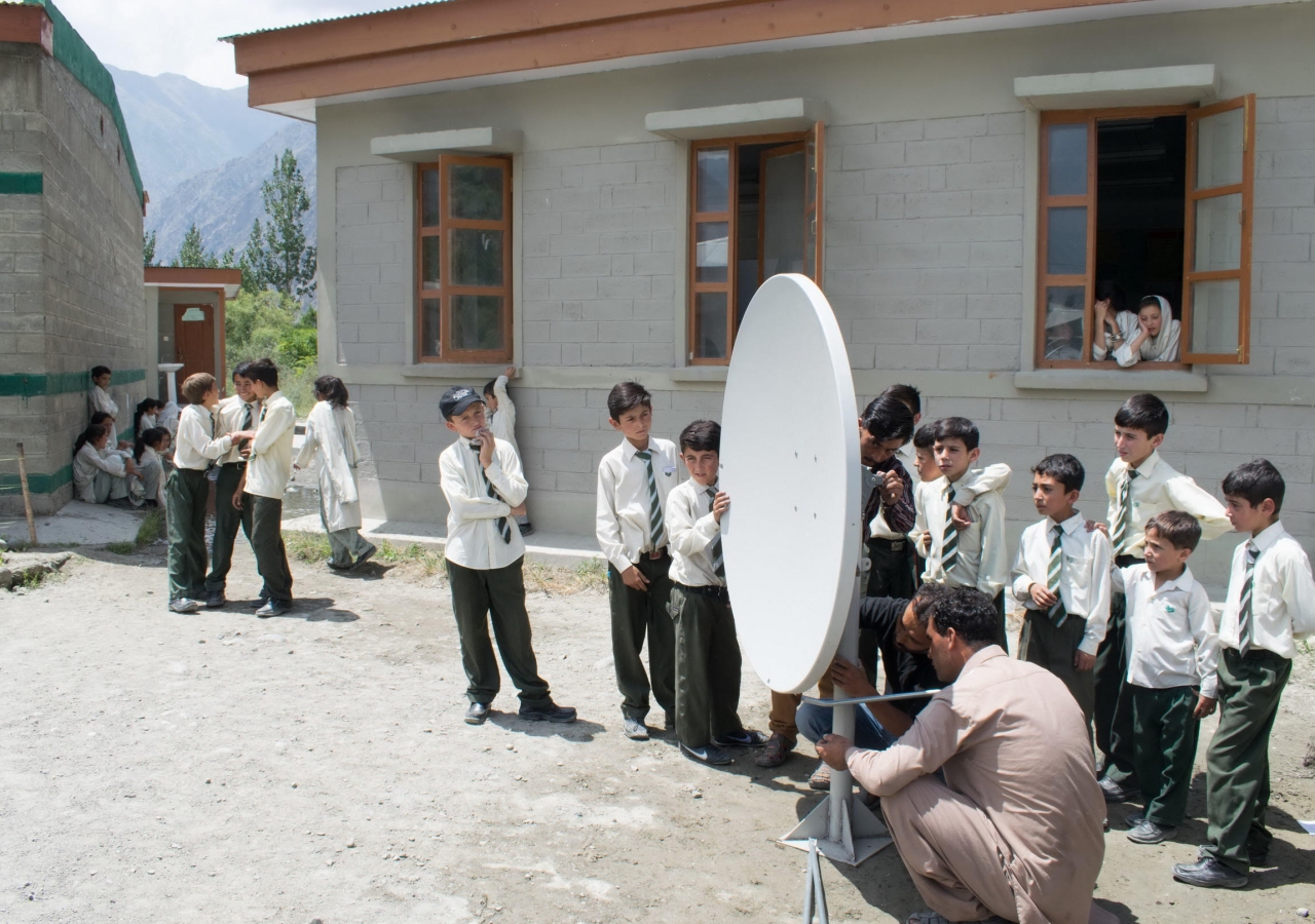 A technician sets up Internet via satellite (IVS) technology