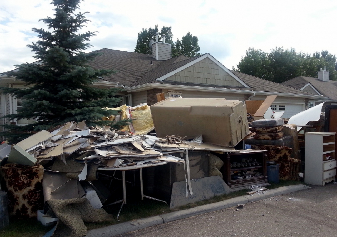 The street in front of homes in High River were piled high with flood debris cleared out from their basements.