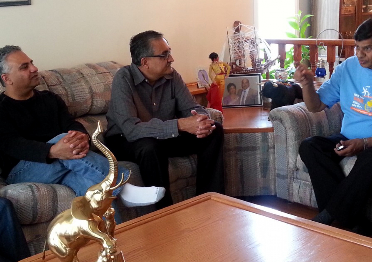 Ismaili Council for Canada President Malik Talib, Honorary Secretary Arif Amlani
and President Mohamud Zaver of the Ismaili Council for the Praries visit with a host family and their guest, who was evacuated from a flooded Calgary neighbourhood.