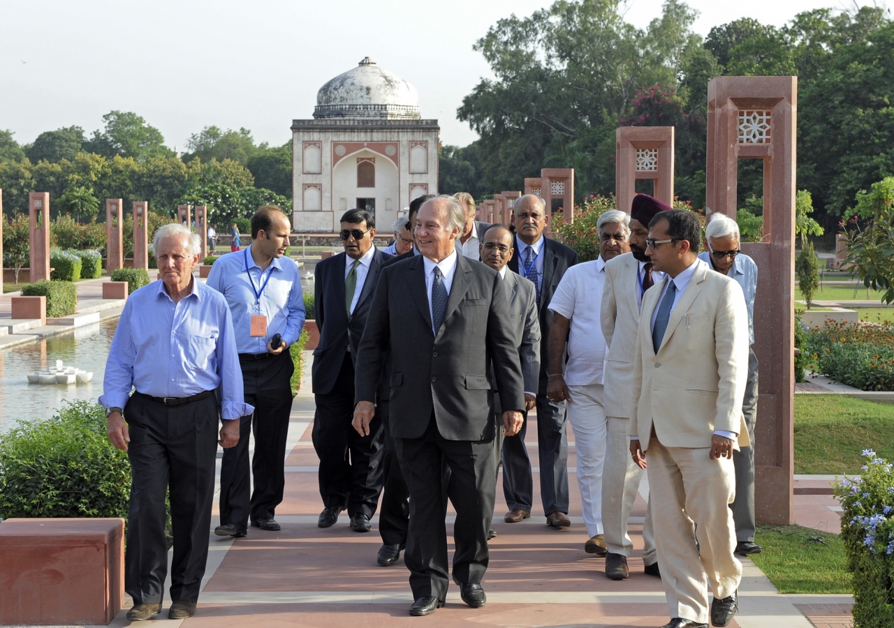 Mawlana Hazar Imam, accompanied by Prince Hussain and officials from the Aga Khan Trust for Culture, walks down the central axis of the Sunder Nursery — once known as Azim Bagh (great garden) — after visiting  the Sunder Burj, a 16th century tomb restored