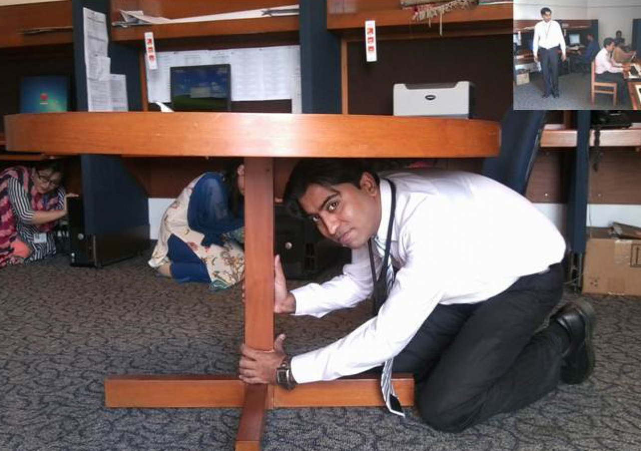 Staff at the Aga Khan University in Karachi Drop, Cover and Hold on during the AKDN ShakeOut drill.