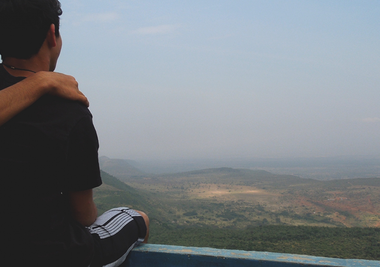 Ismaili friends enjoy each others company as they take in a view of the Great Rift Valley.