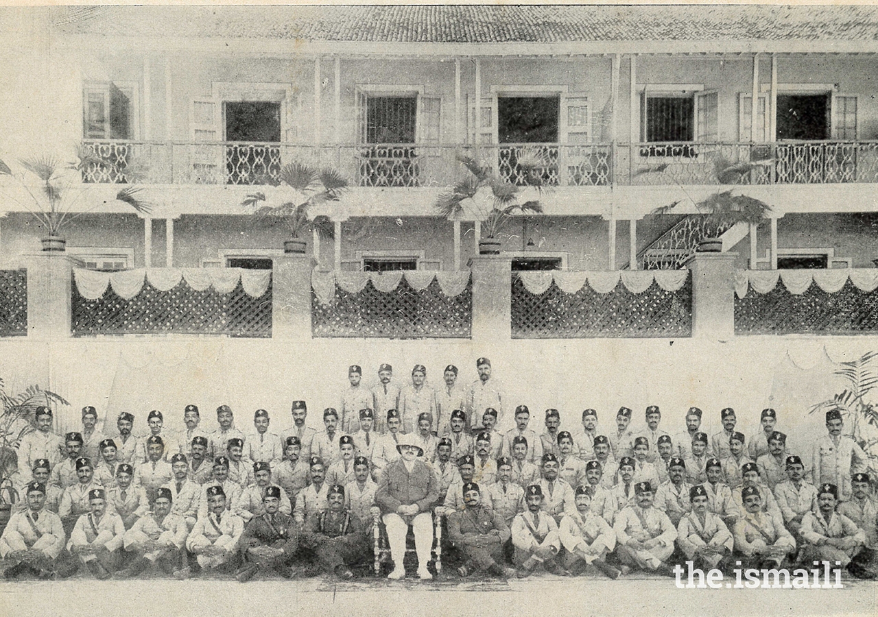 Mawlana Sultan Mahomed Shah in his IVC Colonel uniform surrounded by members of the IVC in India.