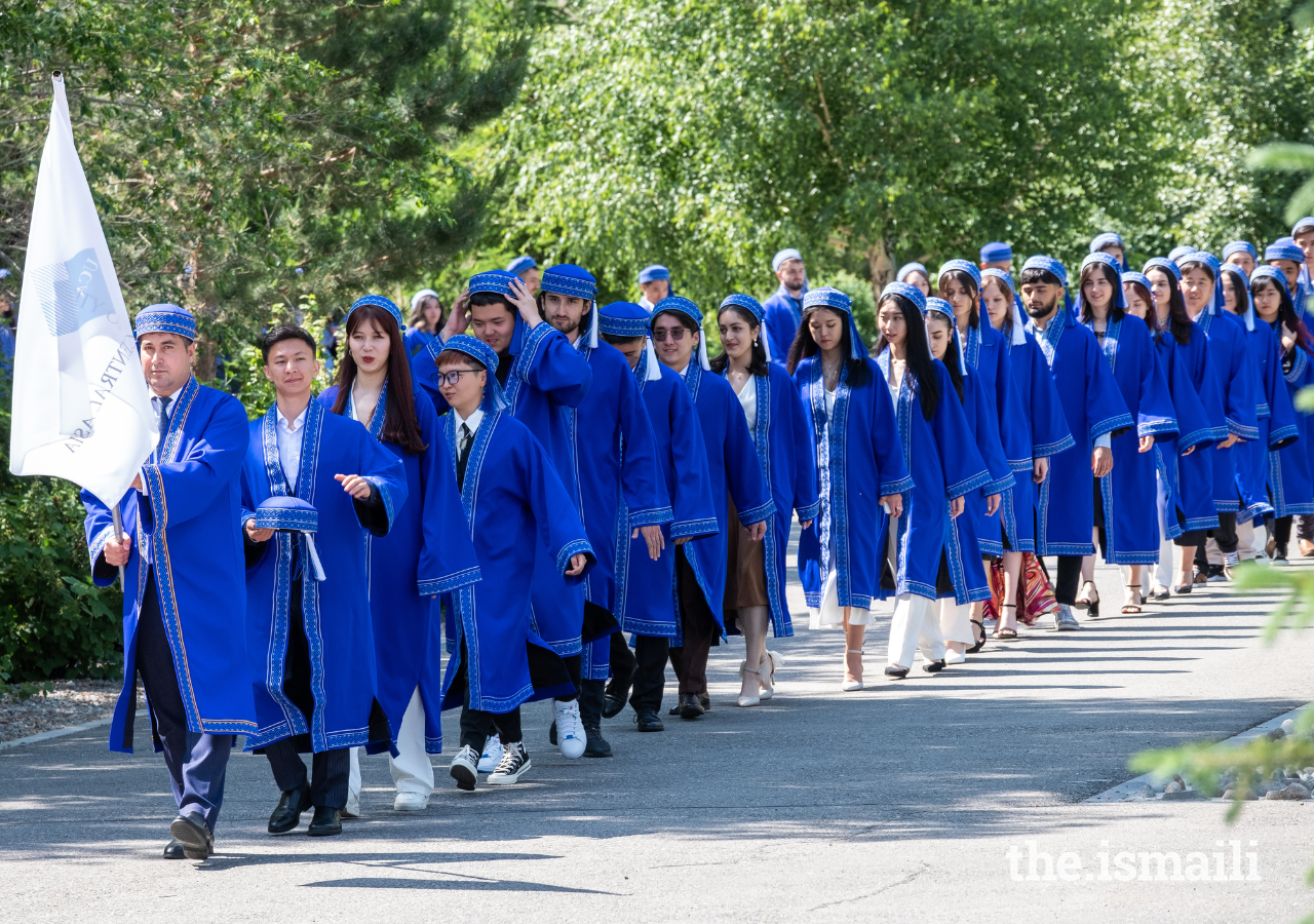 The student procession makes their way towards the graduation hall at UCA’s Naryn campus.