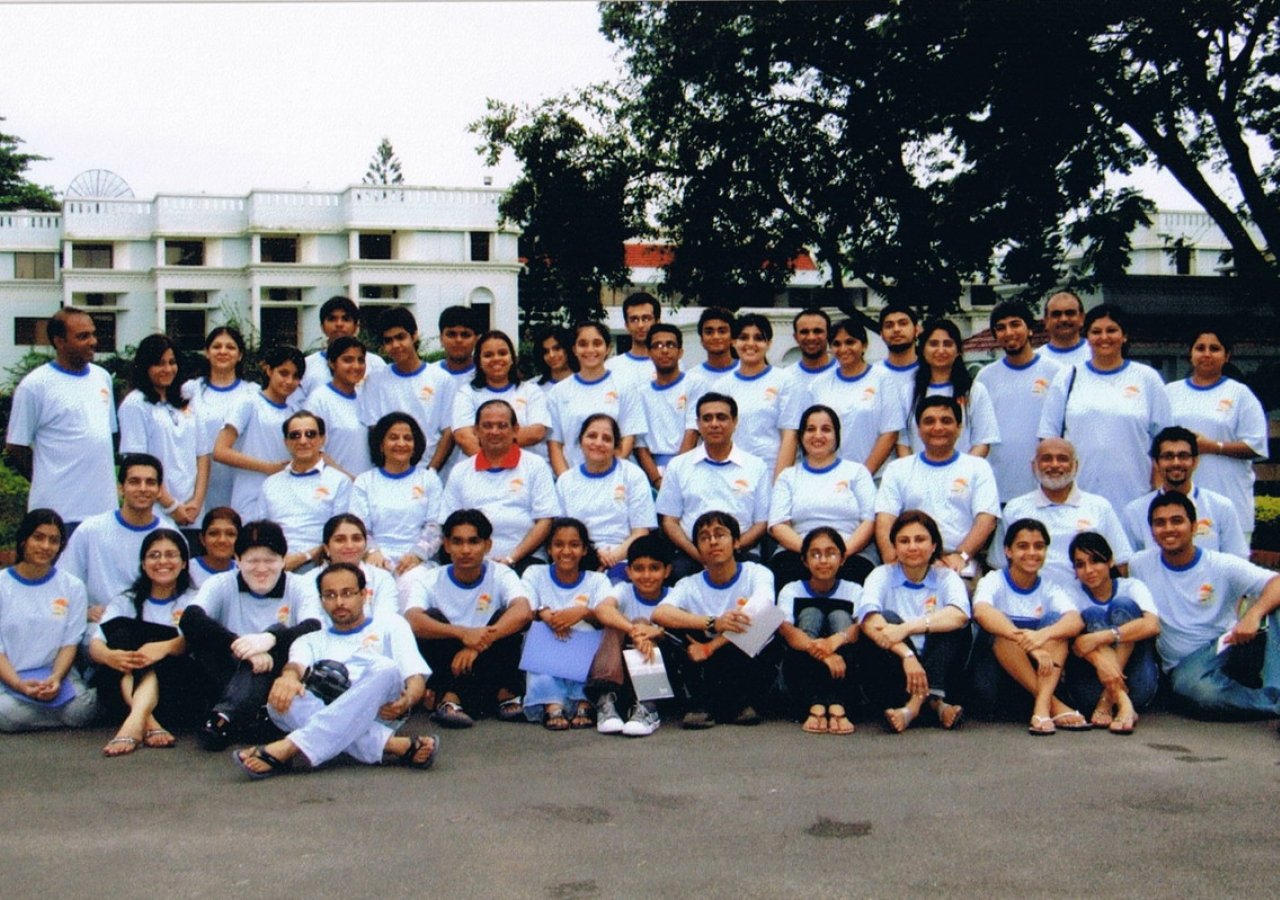 Camp counselors and participants pose for a group photo. 