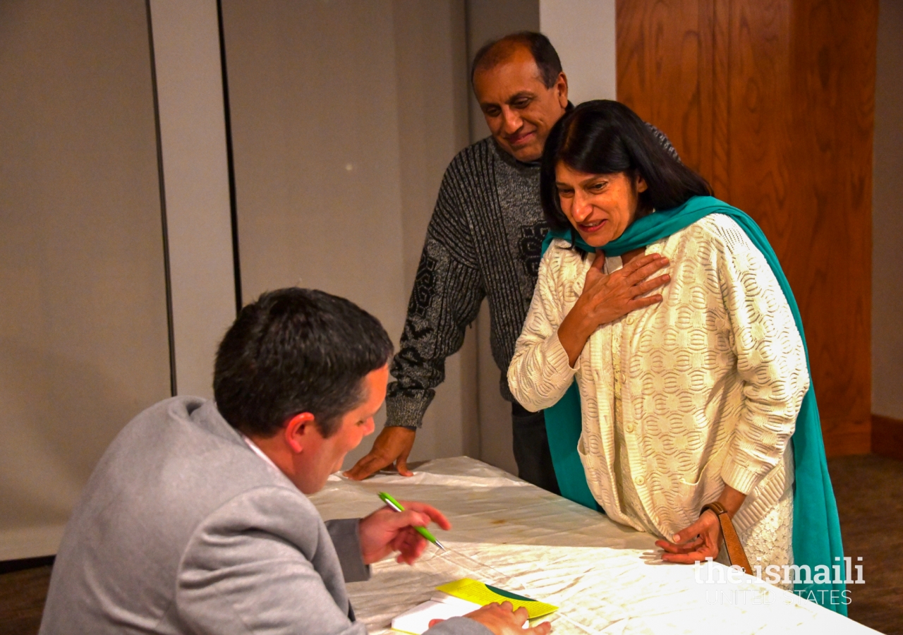 Ruksana and Karim Pirani having their book signed by Dr. Burge. 