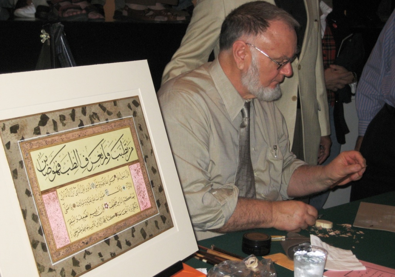 Zakariya demonstrating the art of calligraphy during the workshop session.     