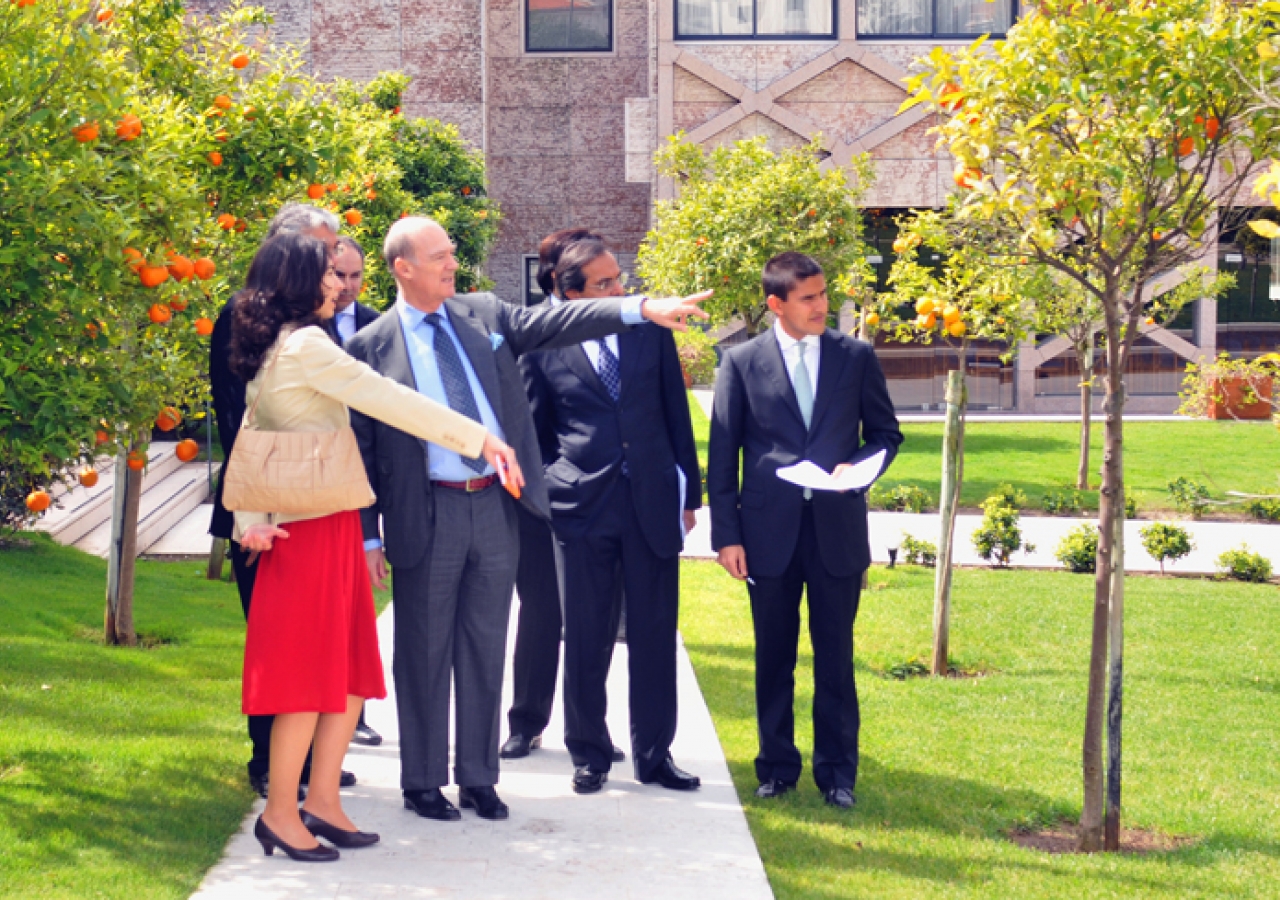 Prince Amyn admiring the orange trees in the gardens of the Centro Ismaili in Lisbon.   