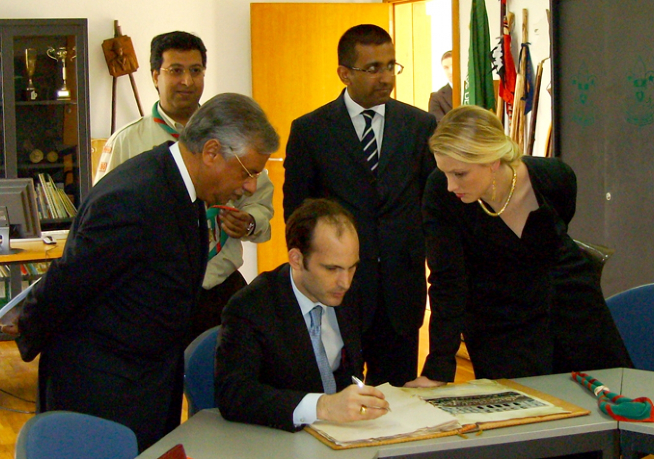 Prince Hussain and Princess Khaliya sign the Visitors Book at the Scouts Headquarters in the Centro Ismaili, Lisbon   