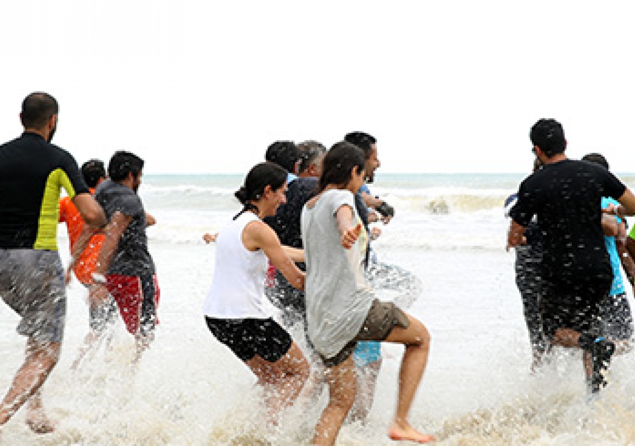 A mad dash into the salty waters of the South China Sea, the symbolic finish line. Alnasir Jamal