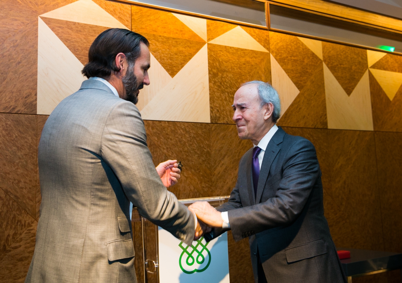 An emotional Dr Daftary receives his long-service recognition from Prince Rahim