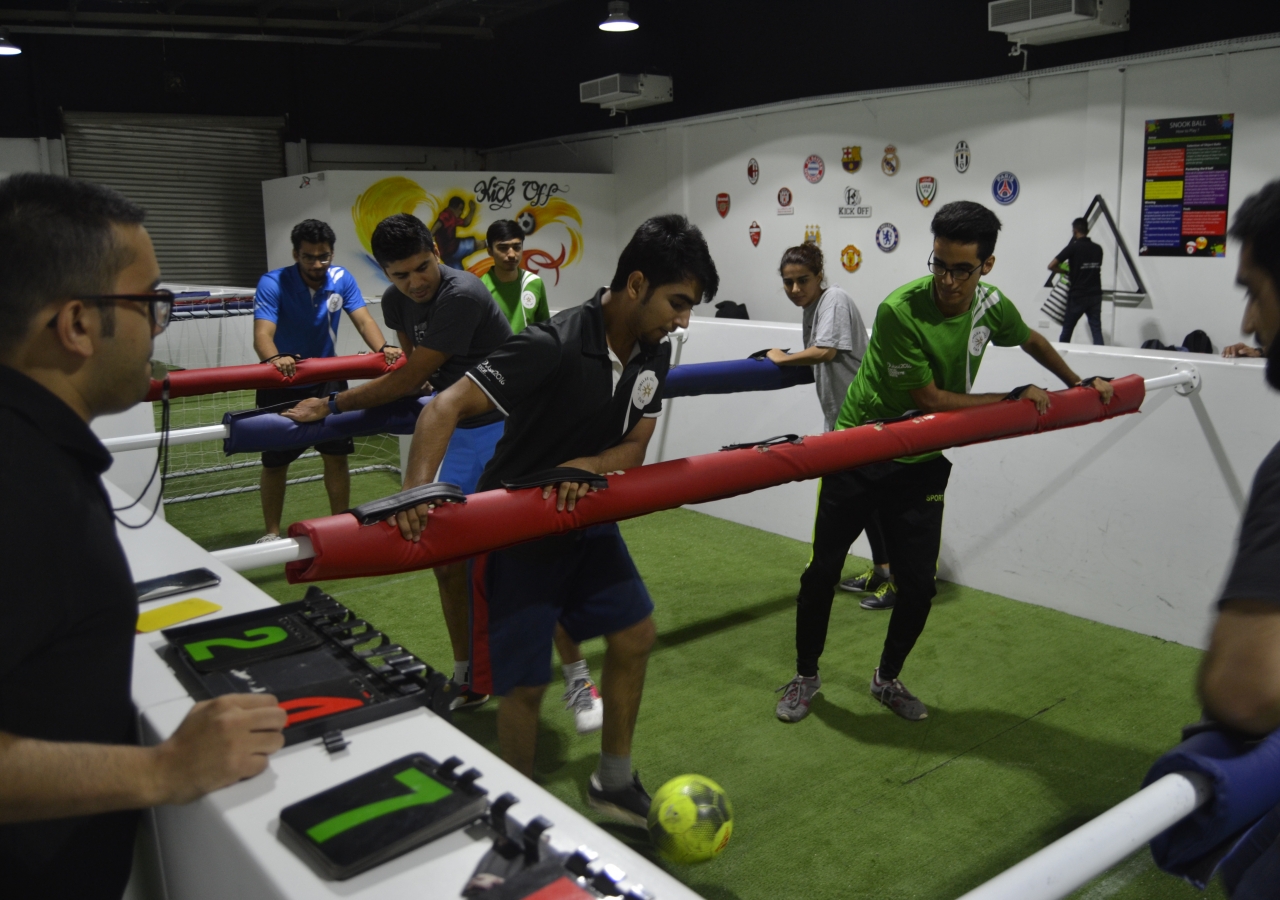 Ismaili youth playing human foosball