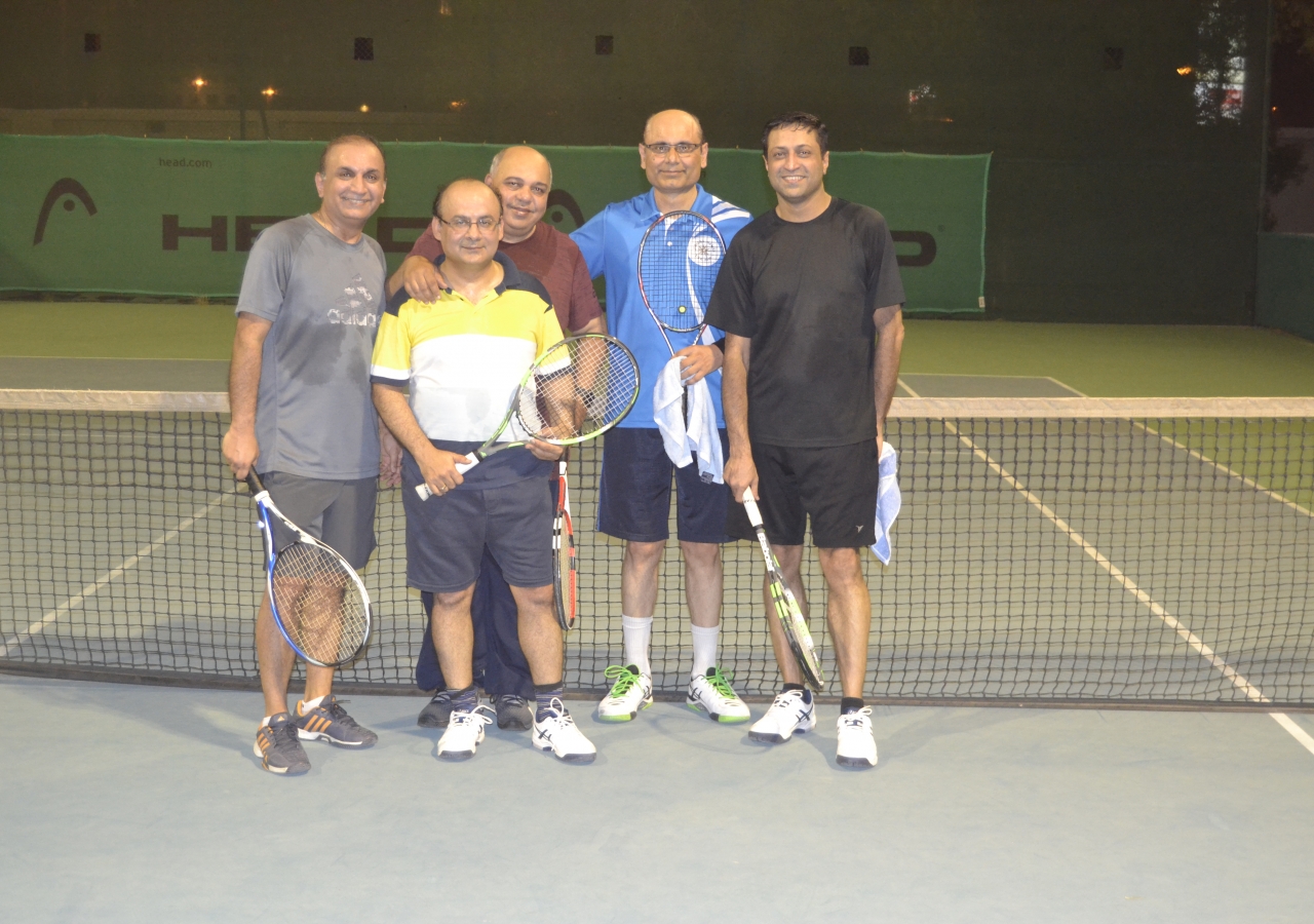 Members of the UAE Jamat playing tennis