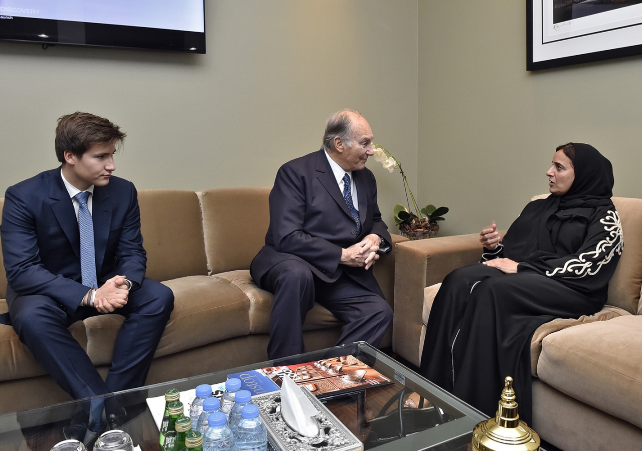 Mawlana Hazar Imam and Minister Sheikha Lubna bint Khalid in discussion as Prince Aly Muhammad looks on. Gary Otte