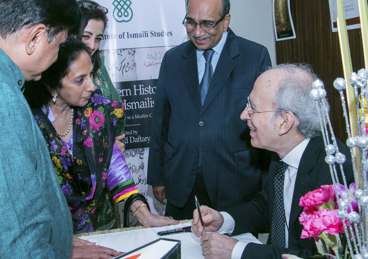 Dr Farhad Daftary signs books for audience members at a book launch event in Mumbai, India earlier this month. ITREB India