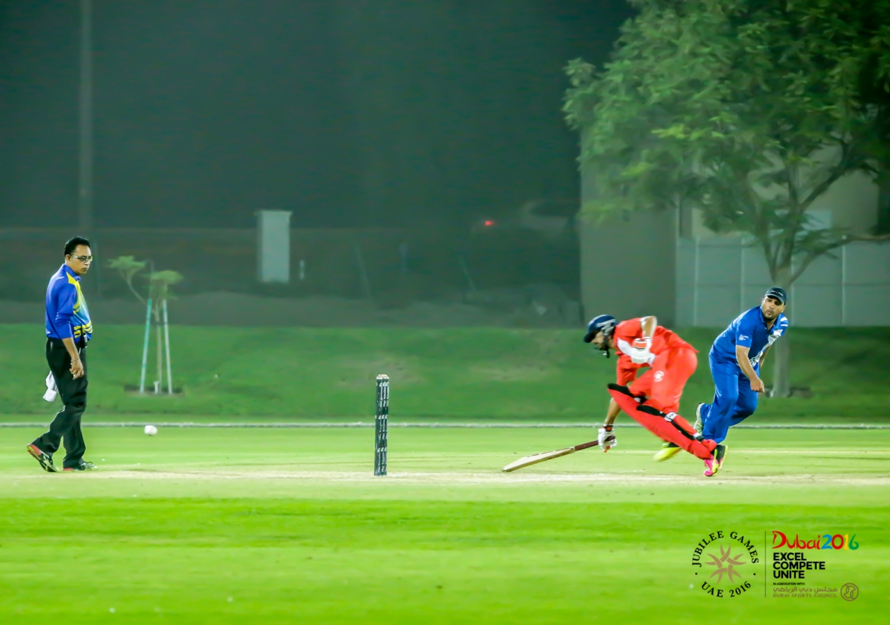 A Team India batsman beats out a throw by a Team Pakistan fielder. Team India scored a total of 128 runs. JG/Shamsh Maredia