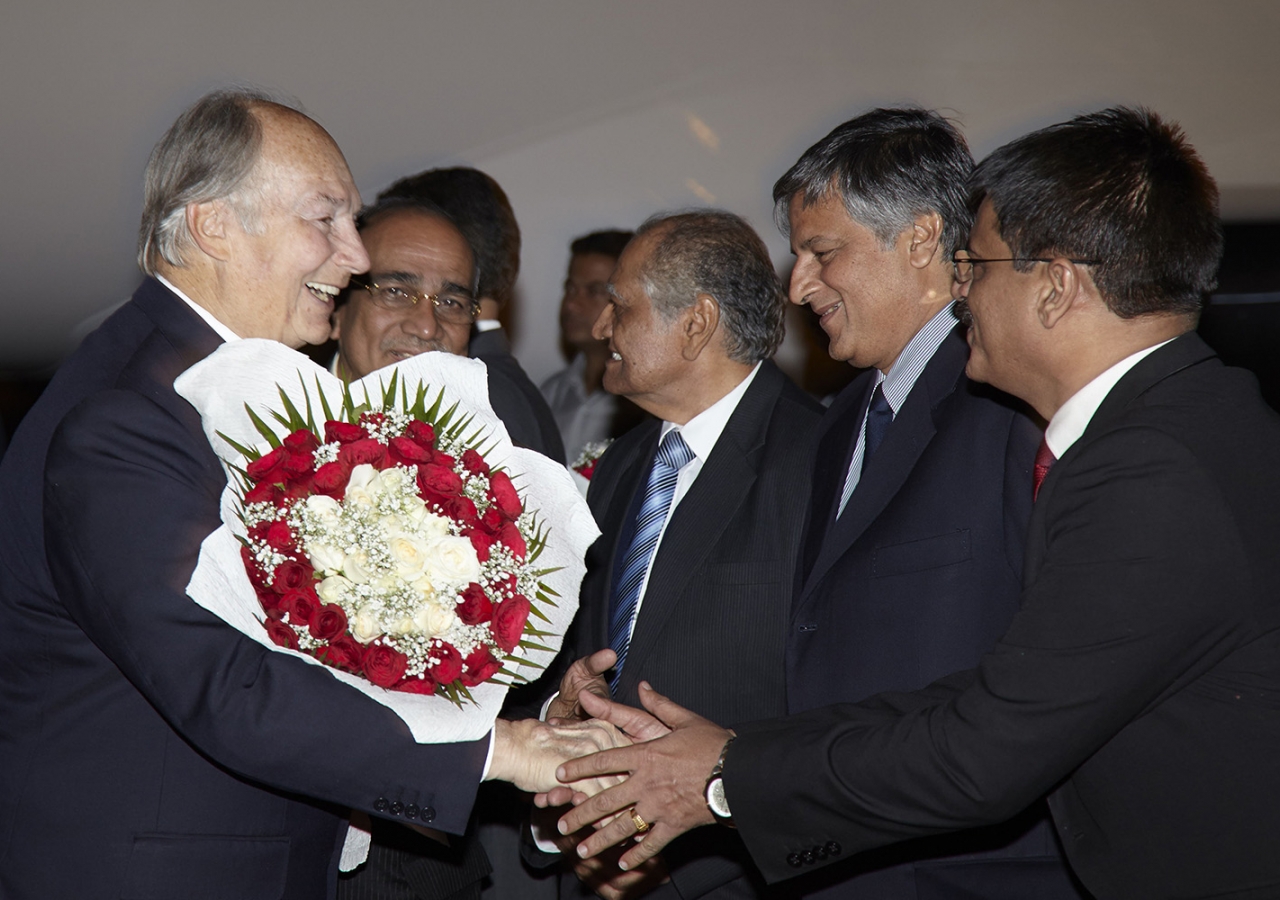 Mawlana Hazar Imam is greeted by leaders of Jamati and AKDN institutions upon his arrival in New Delhi. Aziz Ajaney