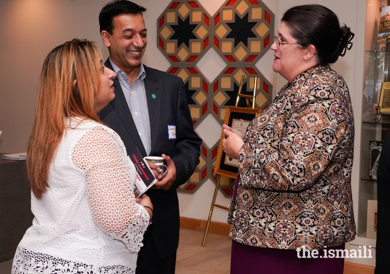 Ismaili Council member Shaukat Dharani and his wife welcome Senator Zahra Karinshak to the Candidate Forum.