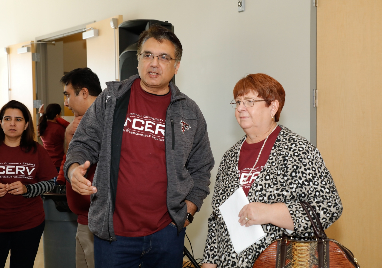 Murad Abdullah, President for Ismaili Council for the Southeastern United States, discusses the I-CERV 60 for 60 project with Charlotte Nash, Chairman of the Gwinnett County Board of Commissioners.