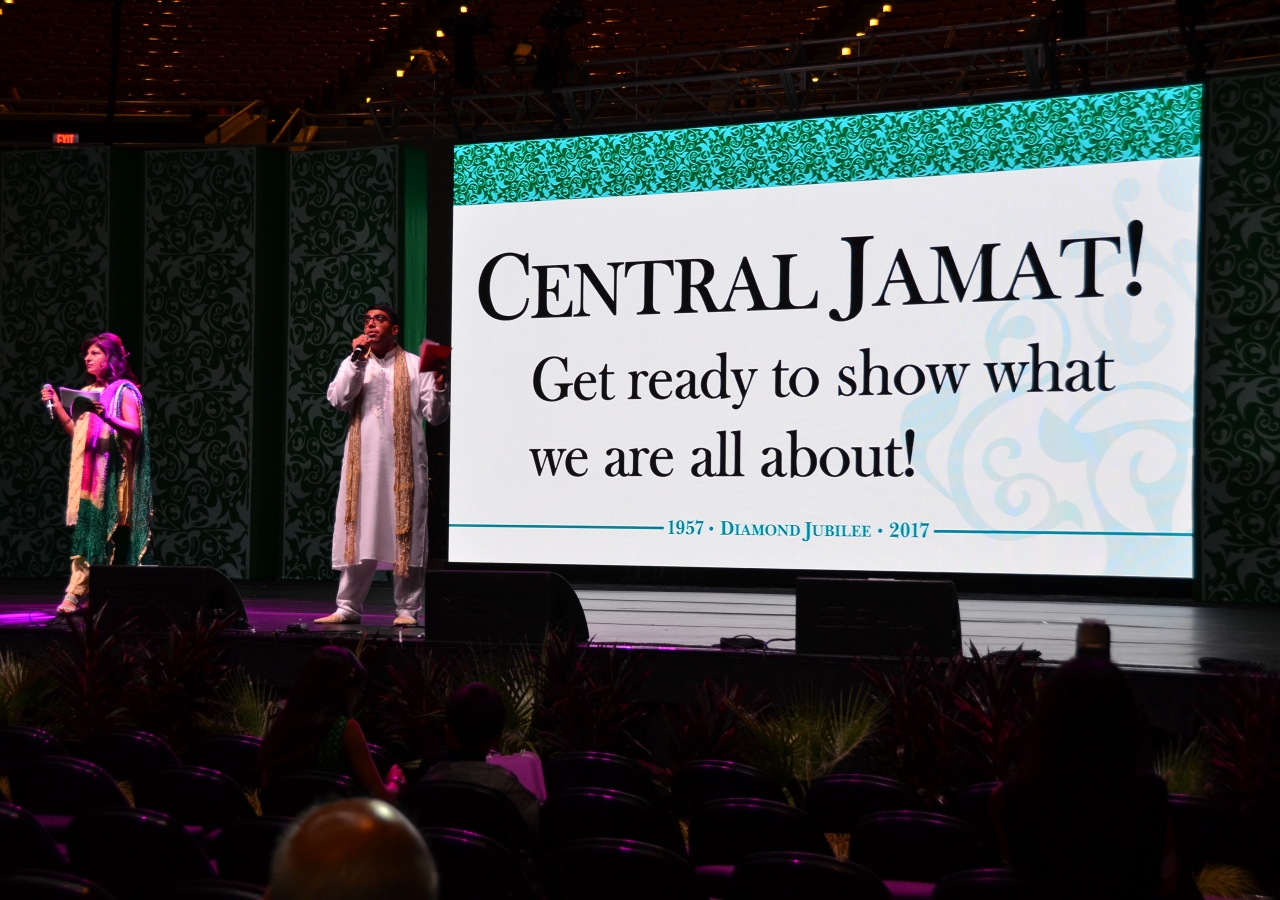 Masters of Ceremonies Aly Panjwani, right, and Karima Lakhani, lead the &quot;One Jamat Launch&quot; on July 11. The ceremonies packed performances and video messages between Jamats to set the stage for the rest of the day.