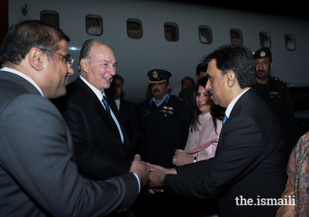 Mawlana Hazar Imam is welcomed by Ismaili Council for Pakistan President Hafiz Sherali and Vice President Hussein Tajani.