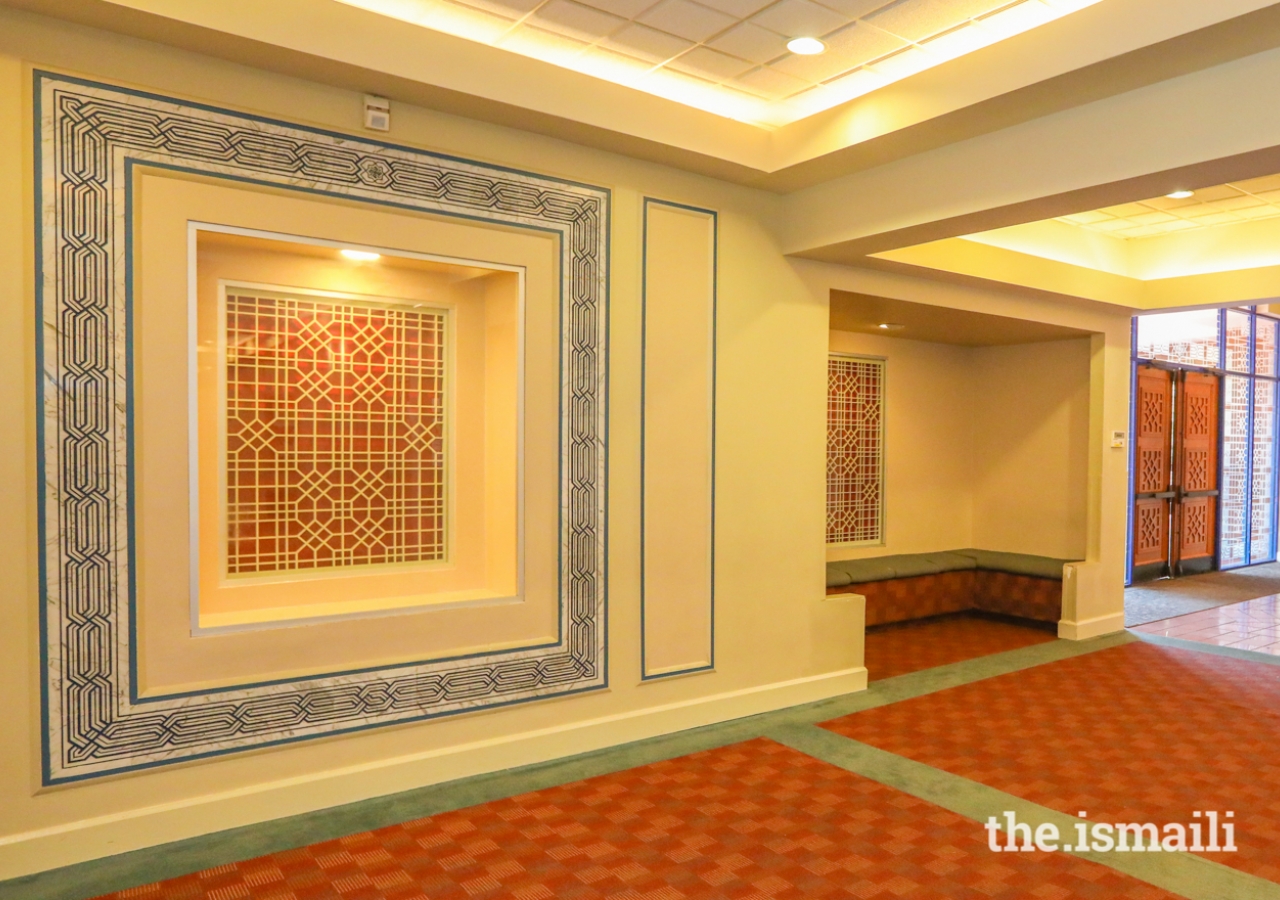 Jali work surrounded by marble with "Allah" etched in Kufic script inside the Ismaili Jamatkhana, Atlanta