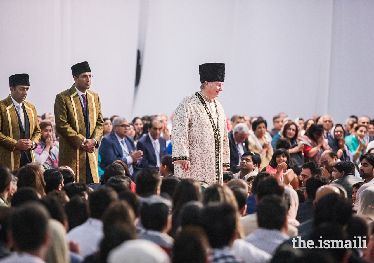 Mawlana Hazar Imam walks through the Jamat during the Diamond Jubilee Darbar in Dubai.