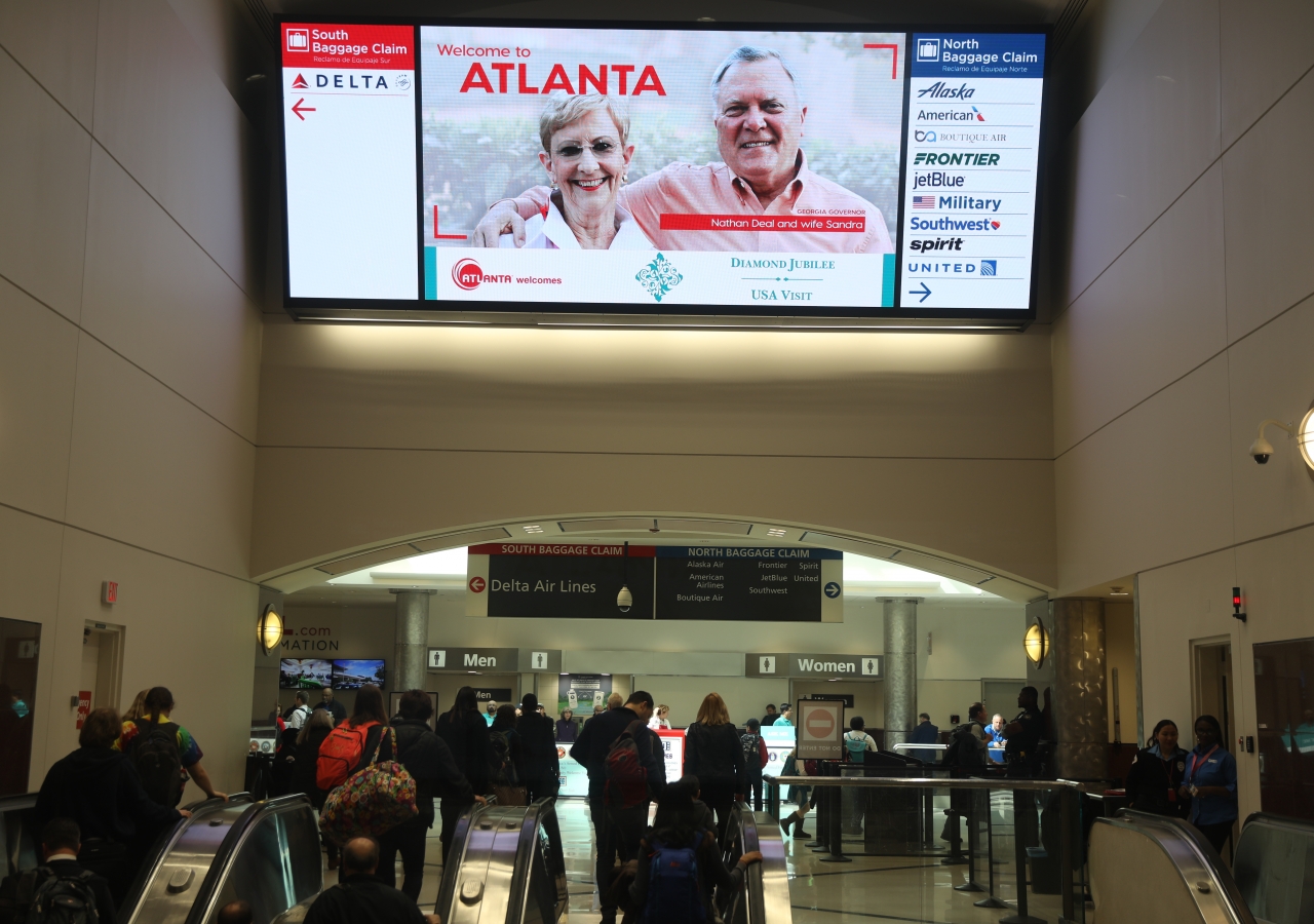 The welcome sign at Atlanta airport, which features the Diamond Jubilee emblem, greets Jamati members upon arrival.