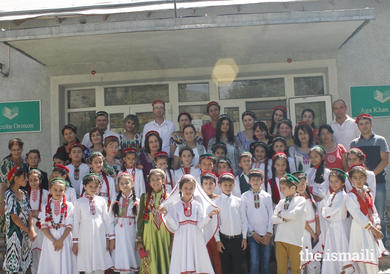 Faculty and students at the Aga Khan Lycée join a group photograph with TKN volunteer Sobia Makhani.