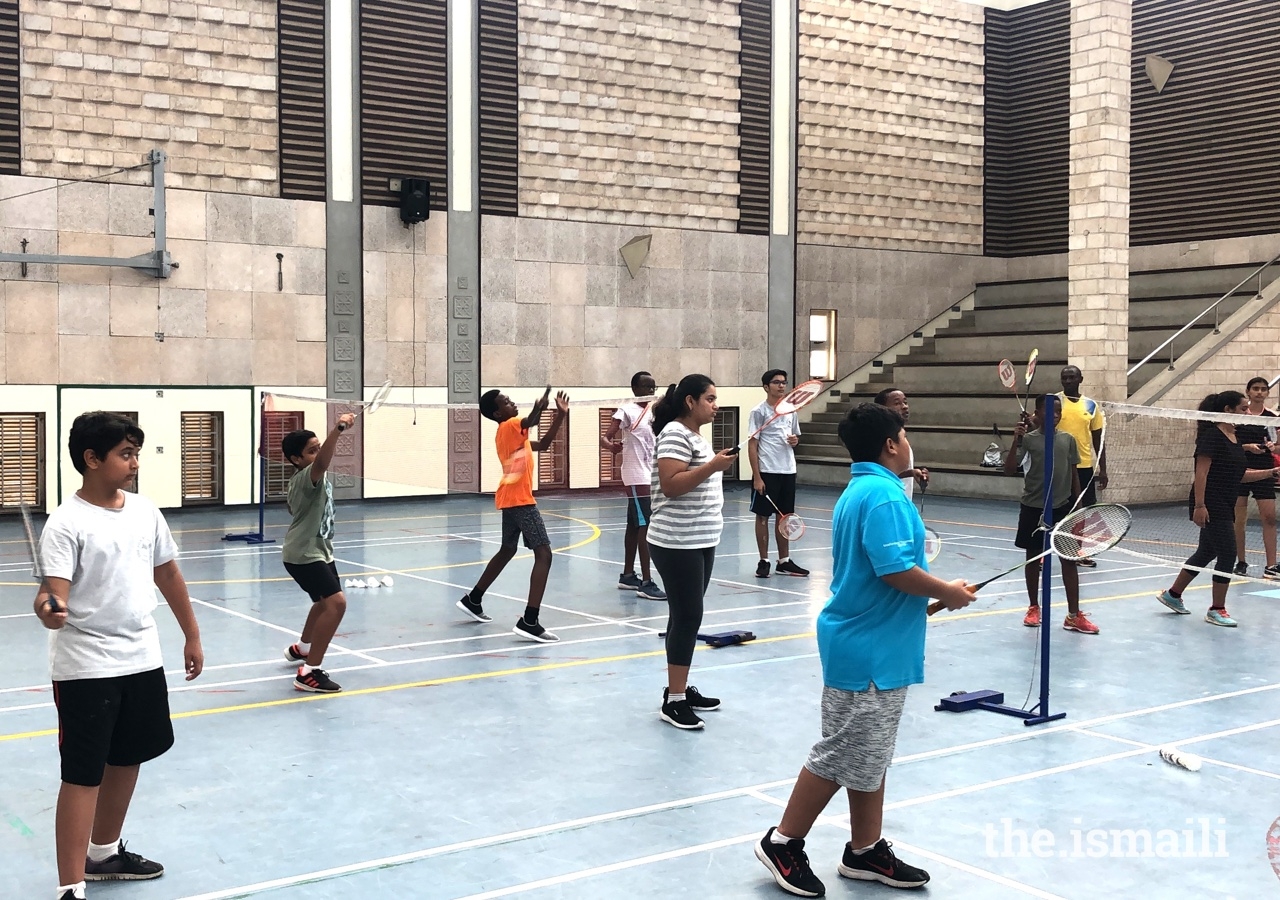 Young students learn the basics of badminton at the Aga Khan Academy in Mombasa.