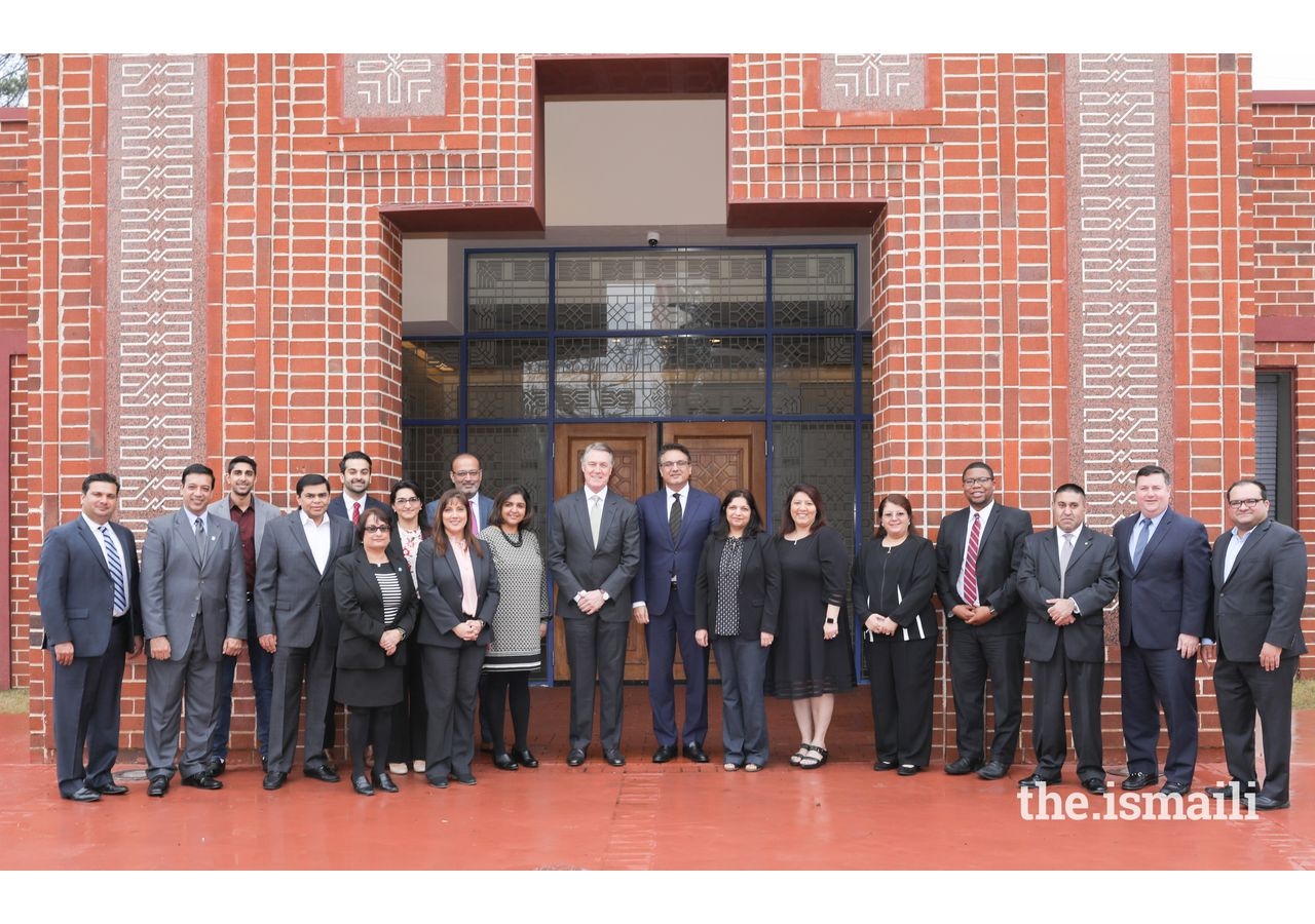 Senator David Perdue joins community members and leaders for a picture during a luncheon at the Ismaili Jamatkhana.