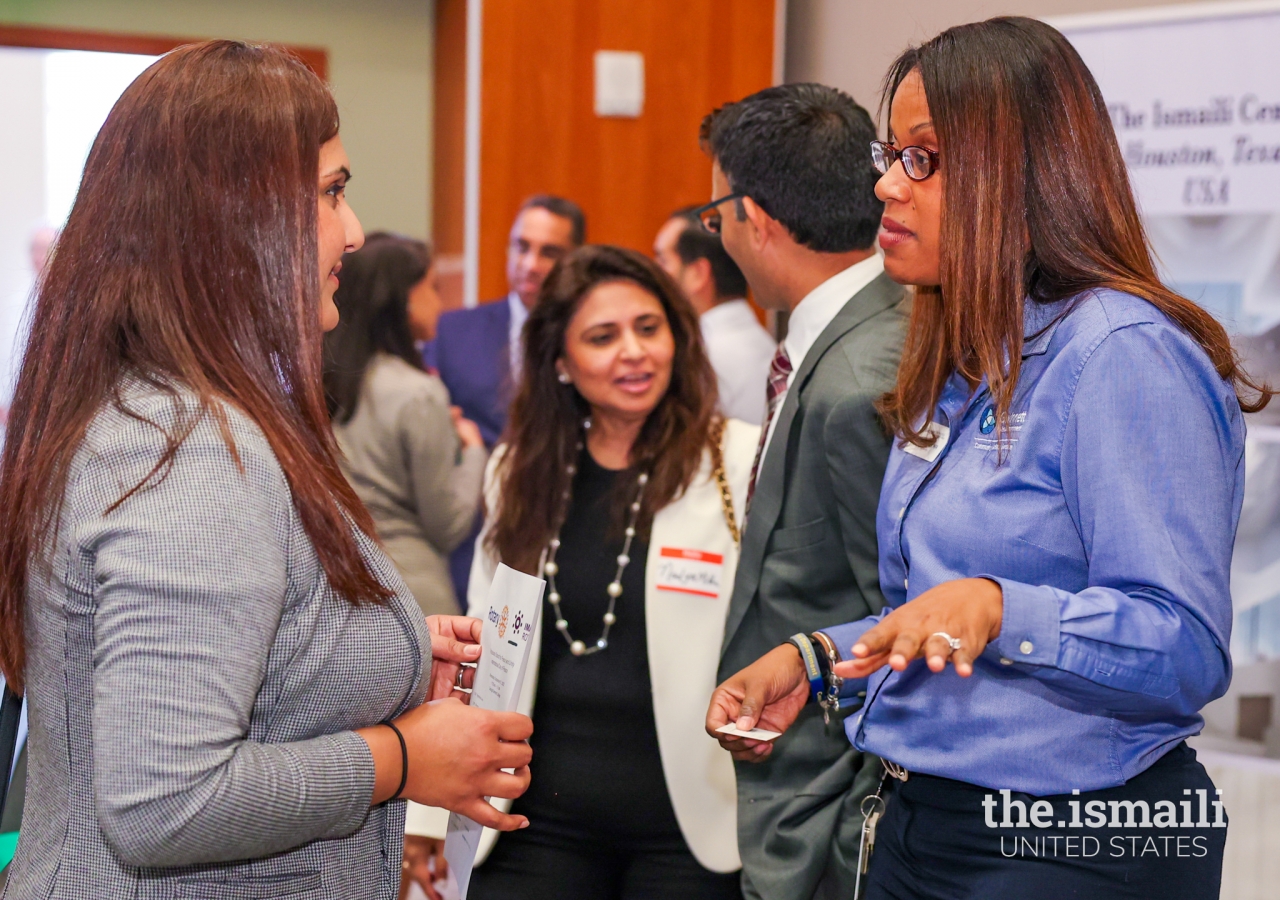 Attendees meeting one another prior to the event.