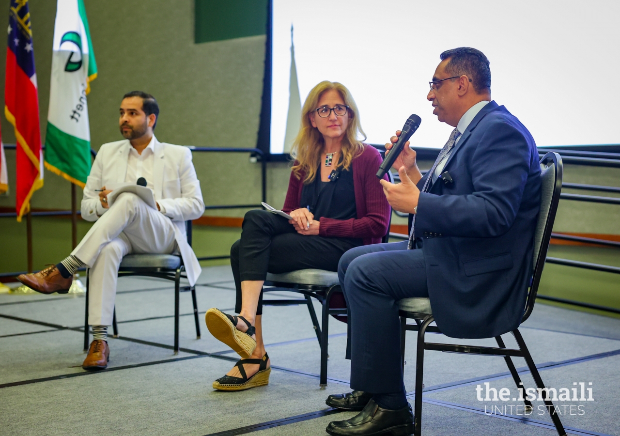 Antonio Molino, Chairman of the Georgia Hispanic Chamber of Commerce, moderating a panel discussion with Jill Savitt and Pres. Al-Karim Alidina