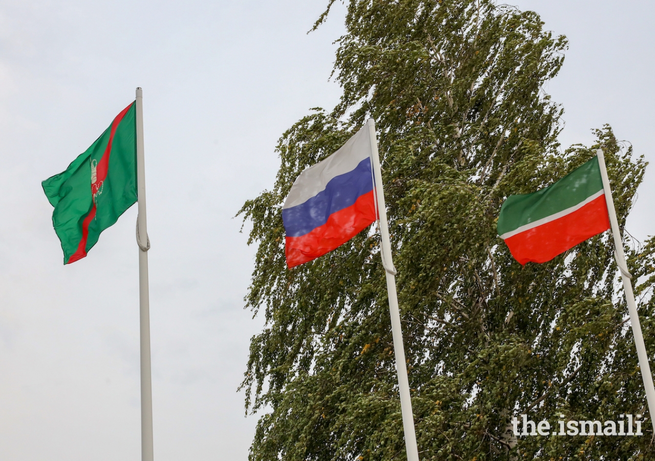 Flags representing the Ismaili Imamat, the Russian Federation, and the Republic of Tatarstan at the Kazan Airport.