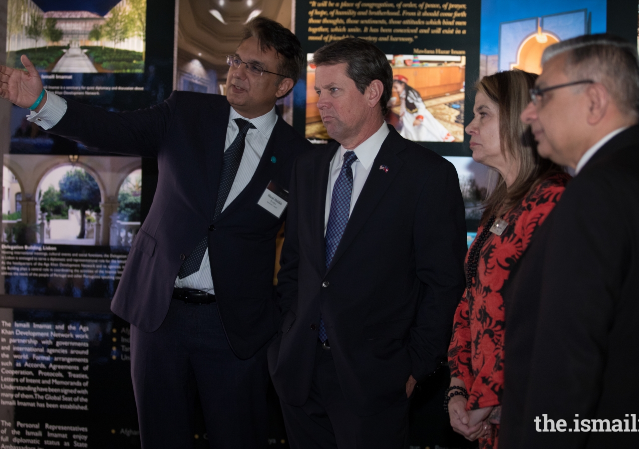 Brian Kemp, Georgia Secretary of State, and Nancy Harris, Mayor, City of Duluth, view the Rays of Light exhibition with Ismaili leadership.