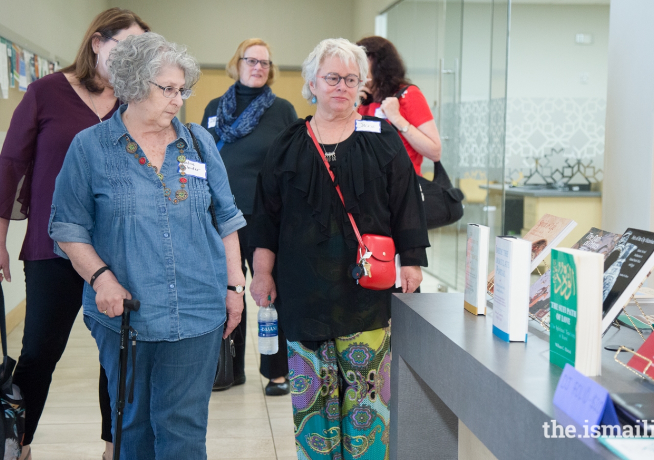 Guests of the Atlanta Jewish Film Festival view IIS publications as they tour the Ismaili Jamatkhana in Norcross, Georgia.