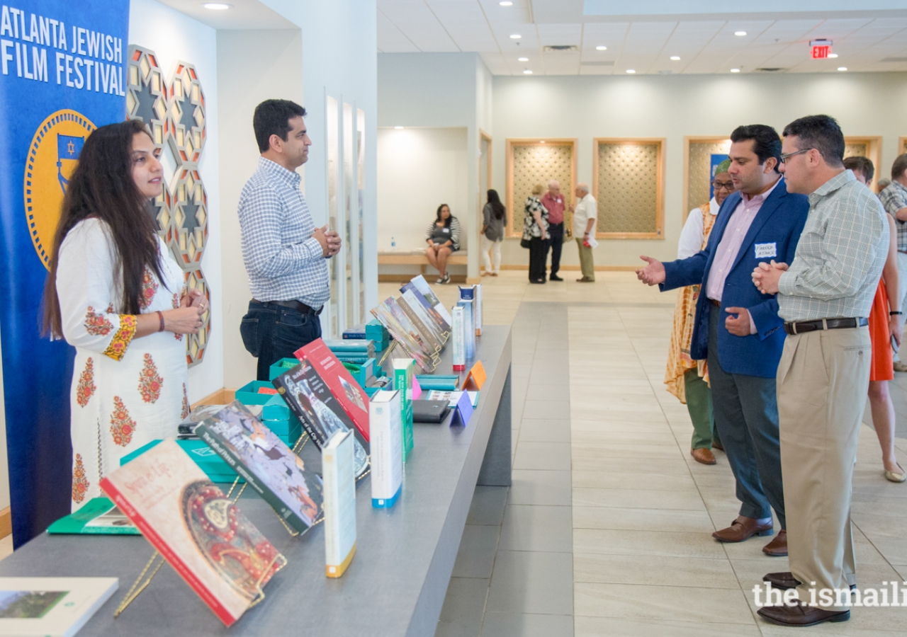 Volunteer Fareed Ajani in discussions with Kenny Blank, Exec. Director of the AJFF, regarding IIS publications.