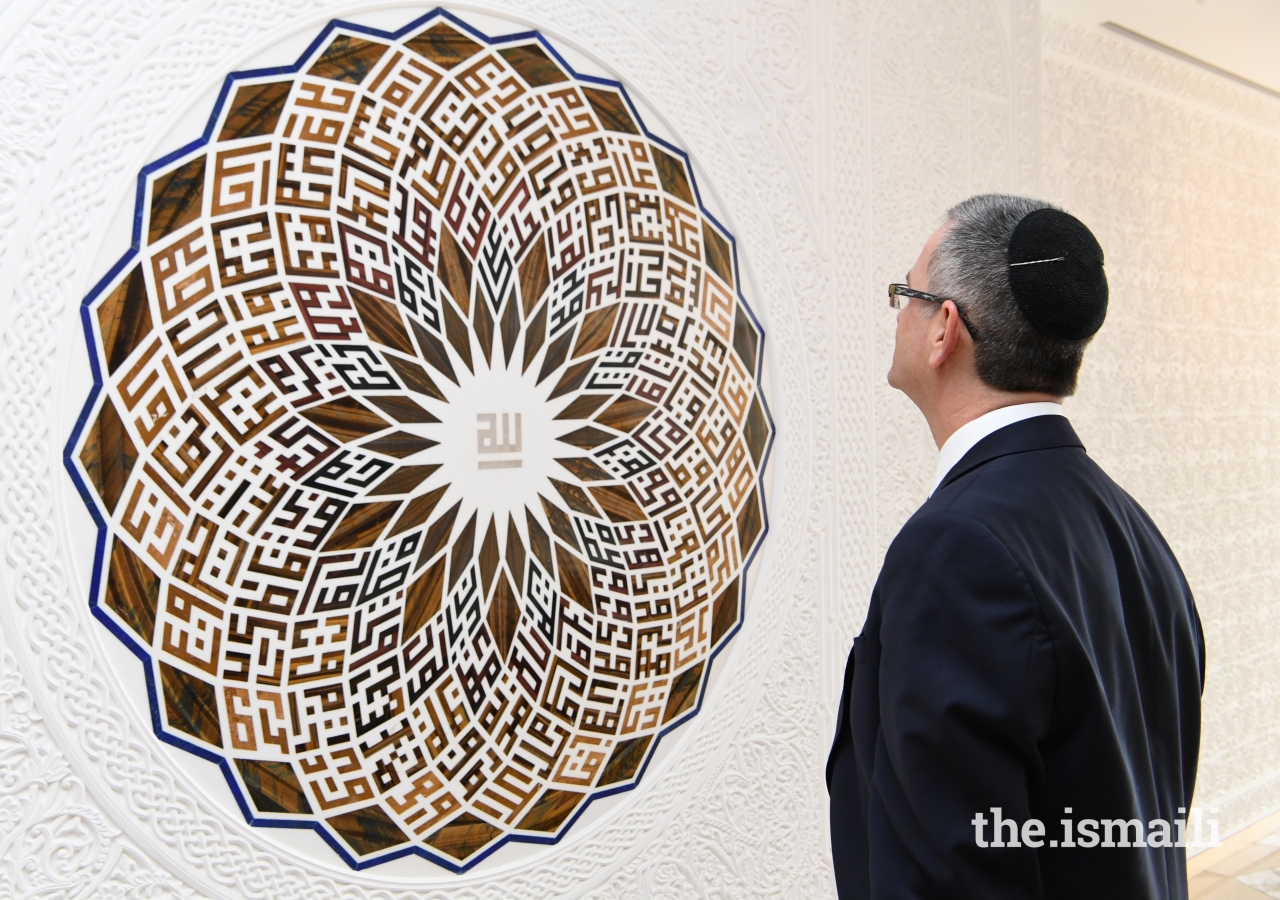 Senior Rabbi of Leo Baeck Temple in Los Angeles, Ken Chasen, admires the “99 Names of Allah” artwork by Minaz Nanji, at the Ismaili Centre, Toronto.