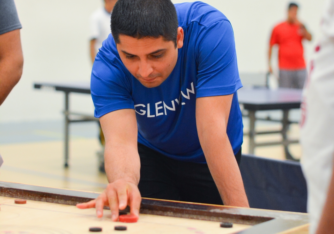 Anil Amlani concentrating on his next shot in Carom.