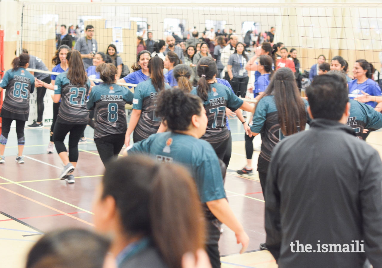 Throwball teams showing good sportsmanship after a hard fought game.