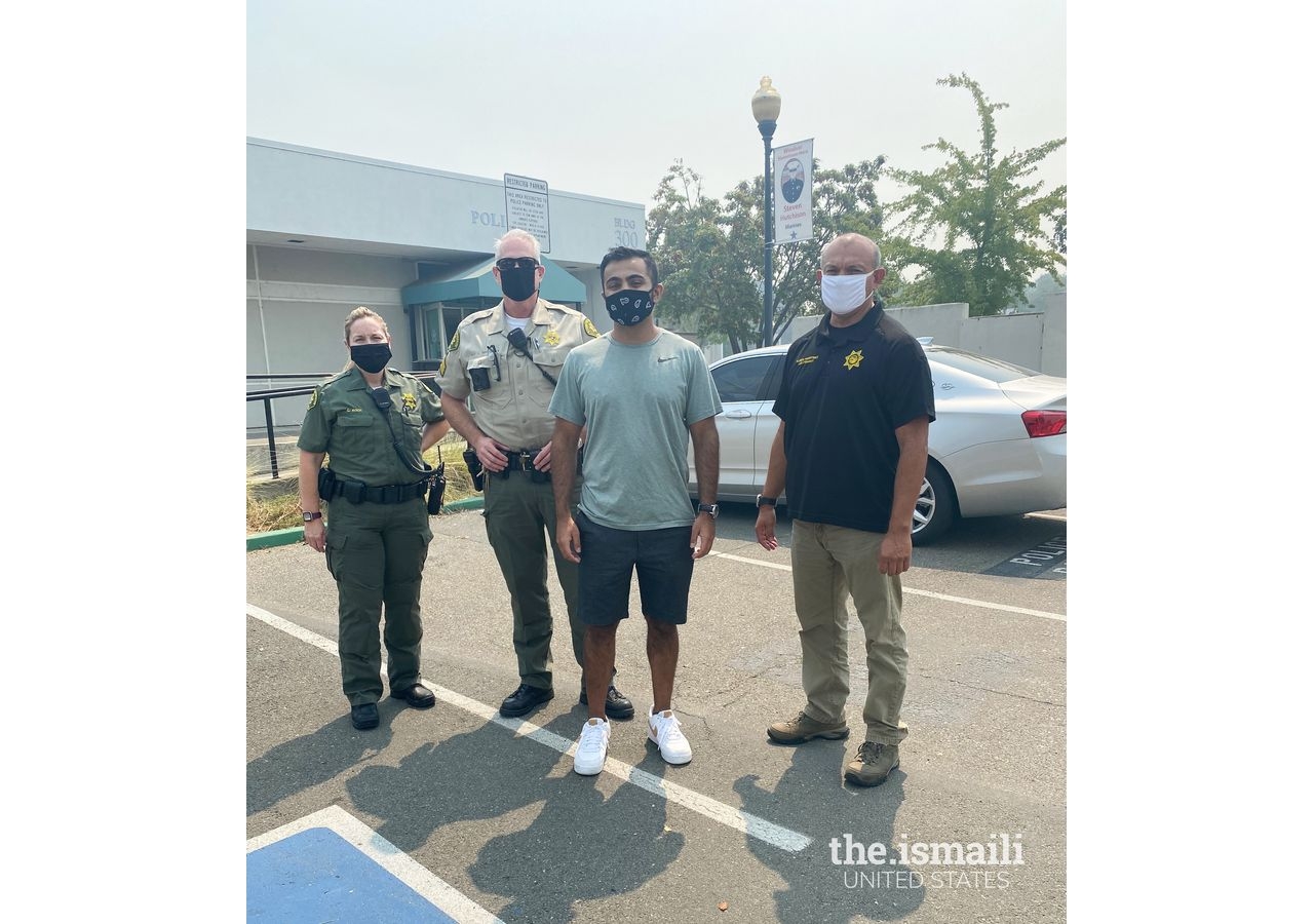 Alim Charania with officers from Windsor police department.