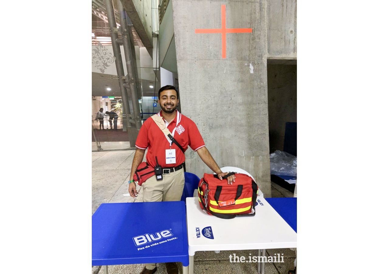 Altamish Daredia volunteering at a medical desk in Lisbon during the Diamond Jubilee celebrations in 2018