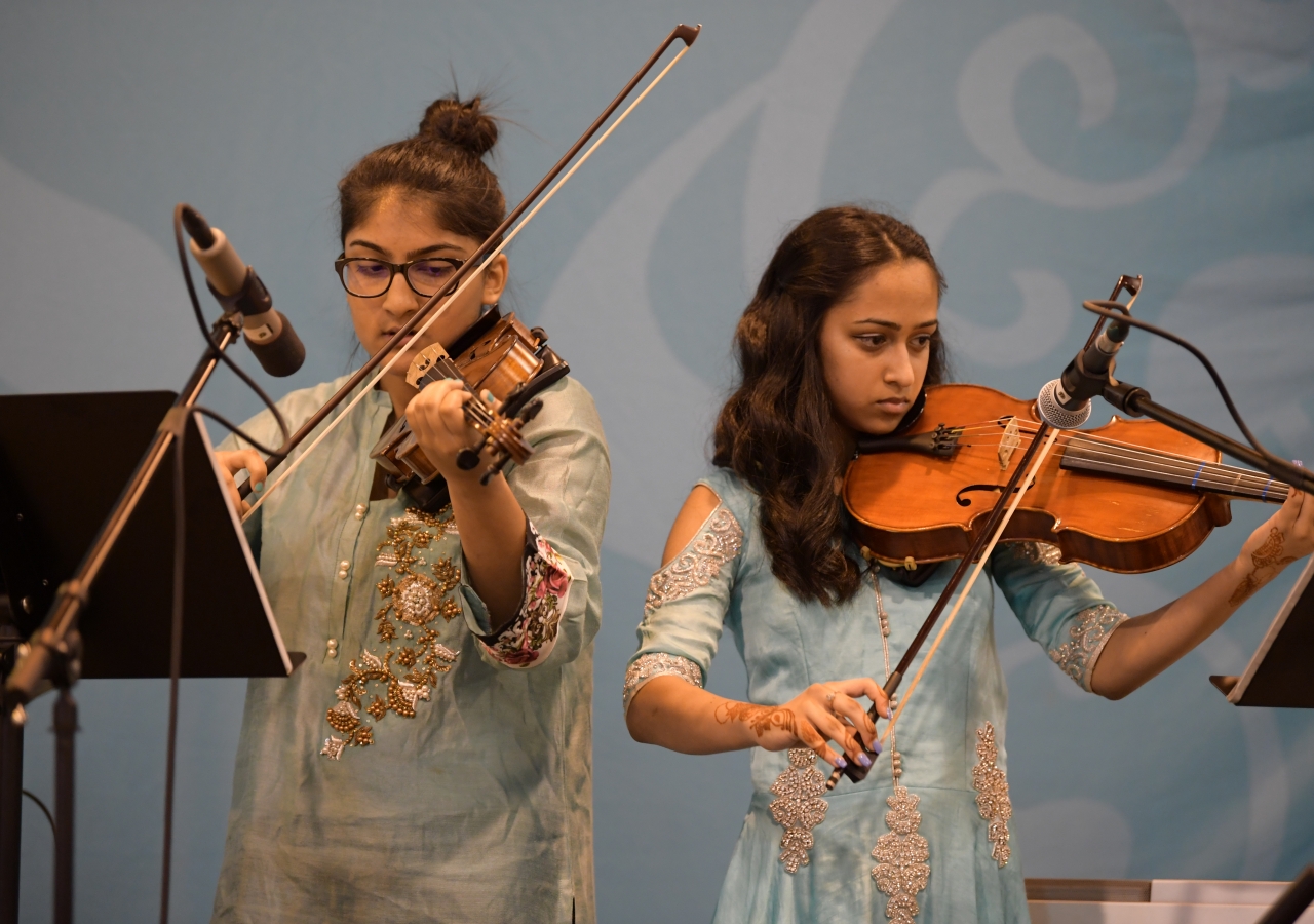 Youth expressing their devotion through music