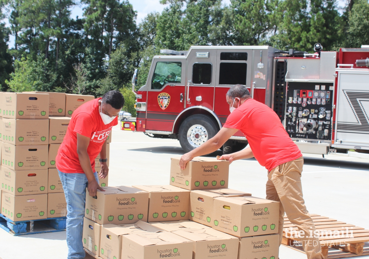 I-CERV volunteers arranging a pallet of food that would get dropped off at one of four local faith-based food pantries.