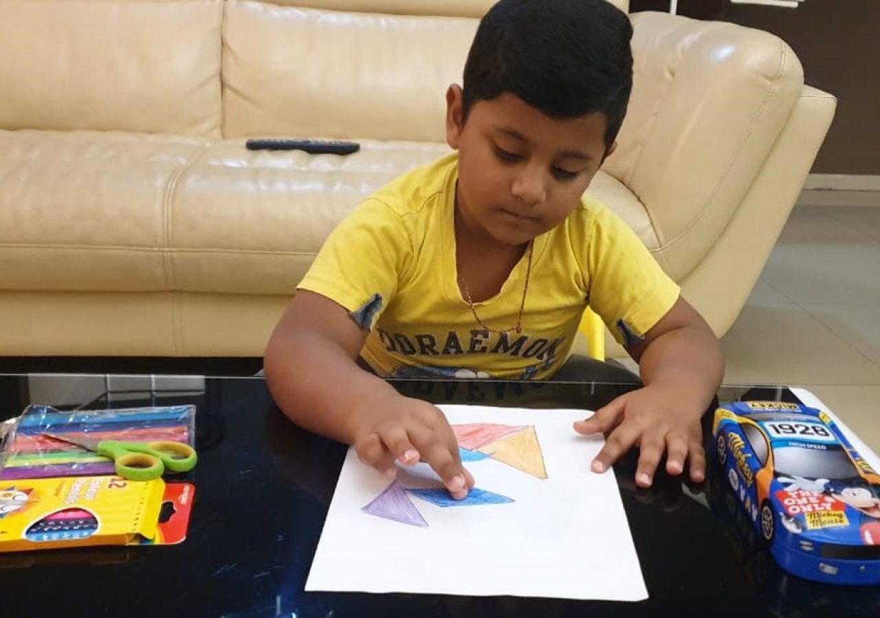 Child drawing a puzzle