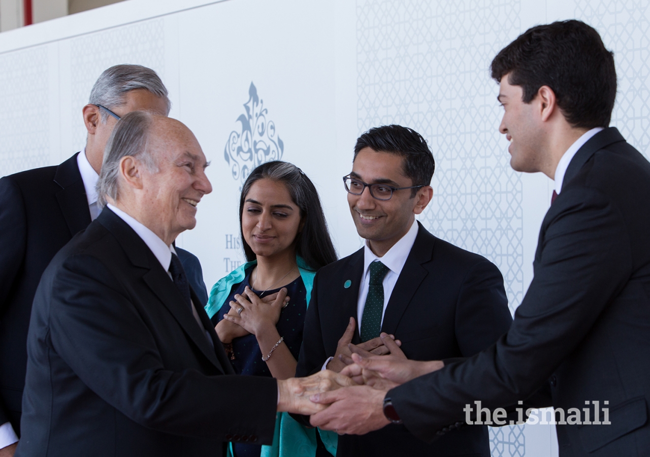 At the airport, Mawlana Hazar Imam greets Jamati leaders assembled for his departure.