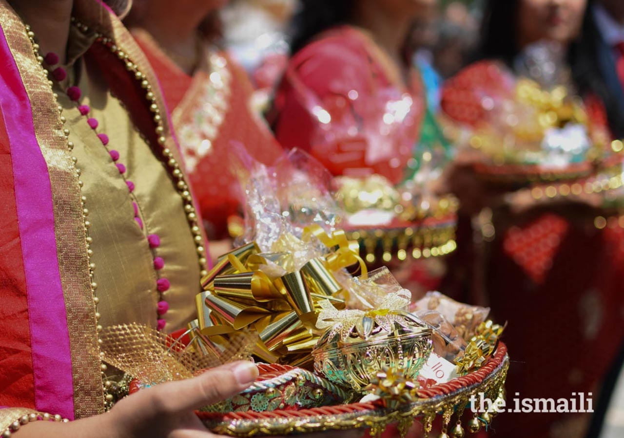 Members of the Portuguese Jamat carry symbolic offerings at the Mamero Ceremony.