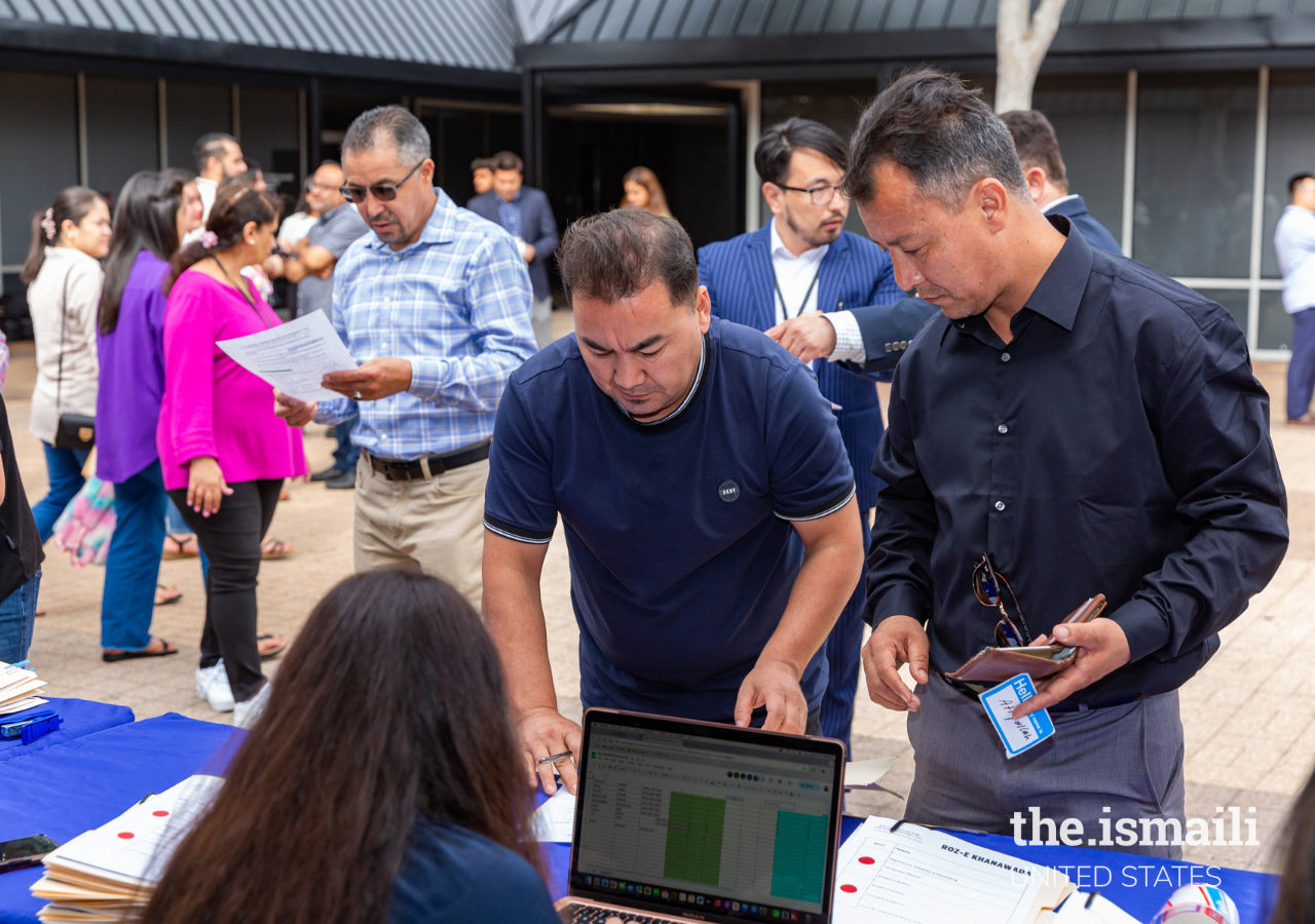  Attendees registration desk at the Roz-e-Khanawada event.