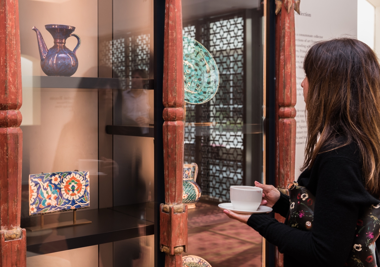 Delegation guest, Ms. Nancy Katano of UCLA, takes in the beautiful artifacts collection at AKM.