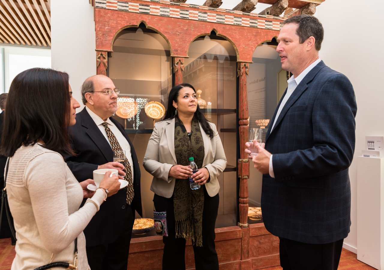 Delegation guests, including Mayor Tim Baldermann, NewGround Board Members, Paul Beck and Aziza Hasan, and Aneeta Muradali of the Ismaili community converse about the importance of arts and culture in the understanding of various faiths.